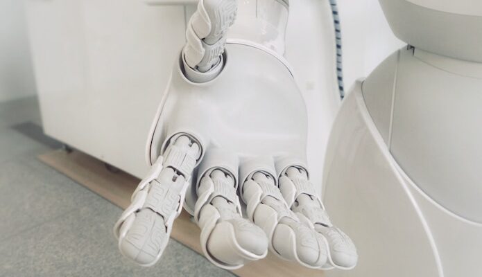 closeup photo of white robot arm